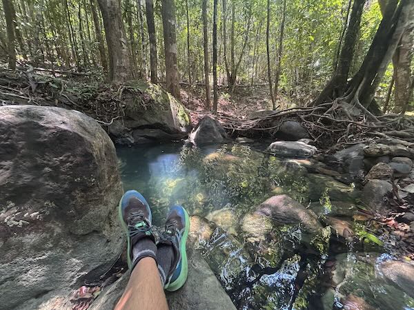 Sitting on rocks along stream at Ngon Nak National Park in Krabi, another great meditation spot.